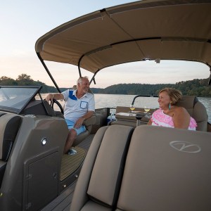 Husband and wife out for an evening cruise on their pontoon